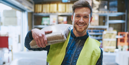 Worker Carrying a Bag